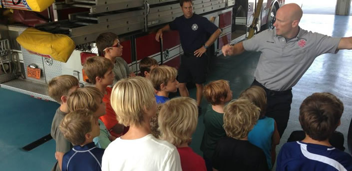 Kids from FAST summer camp in Wilmington, NC visiting a fire station.